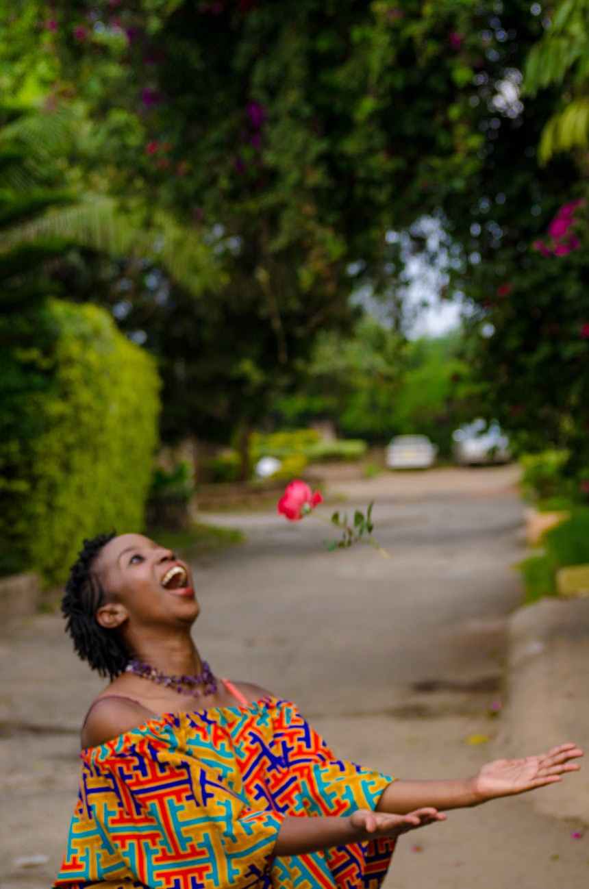 woman catching pink flwoer